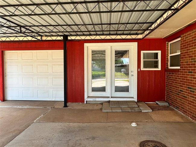 Property entrance featuring a garage | Image 4