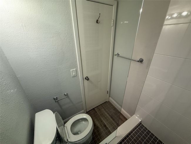 Full bathroom with tile patterned flooring and a shower | Image 19