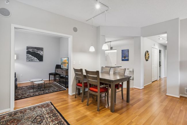Informal Dining Area featuring Hardwood Flooring and Upgrade Lighting | Image 8