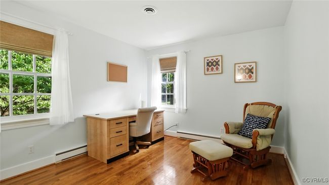 Office area with a baseboard radiator and light wood finished floors | Image 19