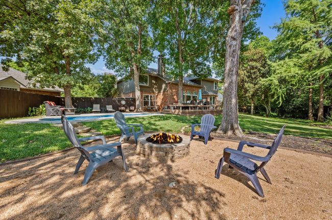 View of yard with a patio, an outdoor fire pit, and a deck | Image 32