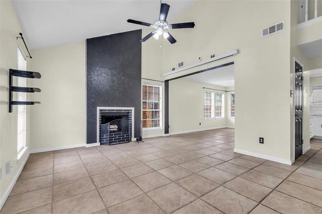 As you enter the home, you’re welcomed by the living room. | Image 4