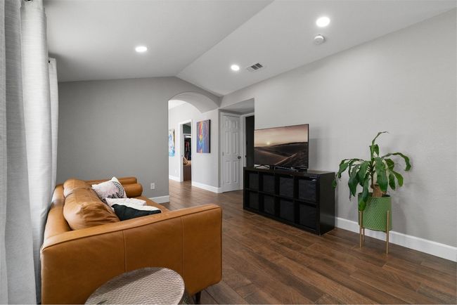 The open-concept living area promotes easy conversation and connection, making it a space where people come together naturally | Image 6