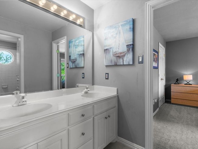 Bathroom featuring double vanity and baseboards | Image 28