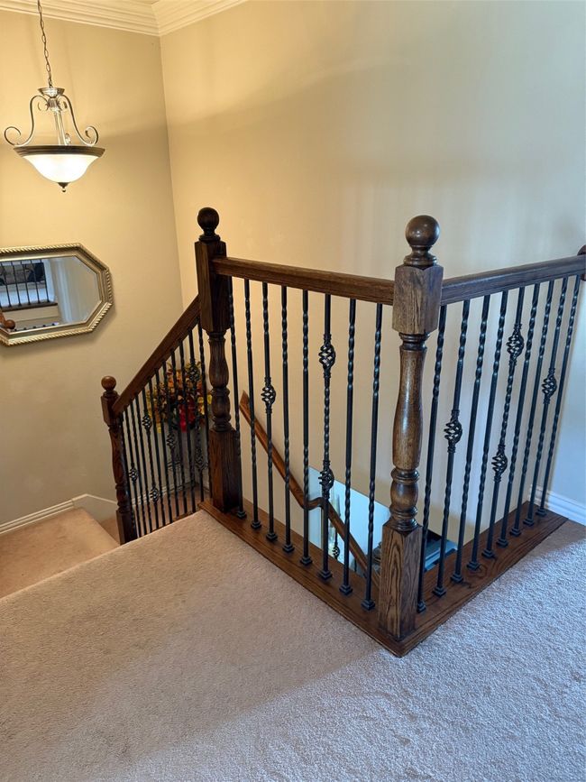 Staircase with crown molding, carpet flooring, and baseboards | Image 27