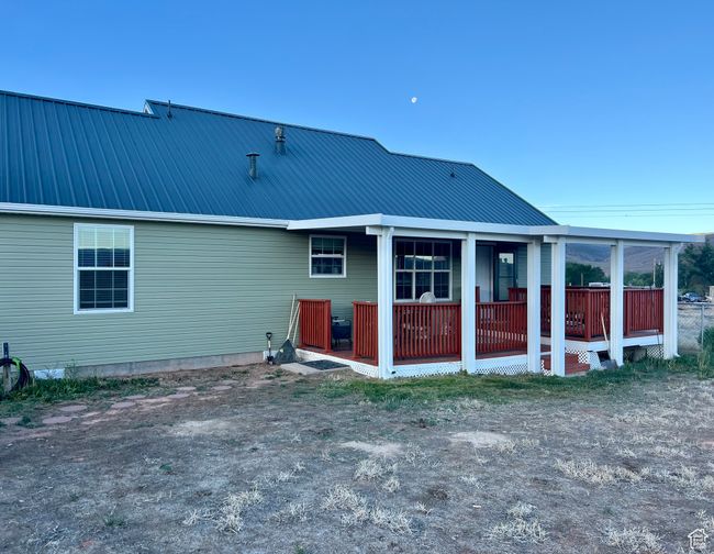 Rear view of house with a metal roof | Image 5
