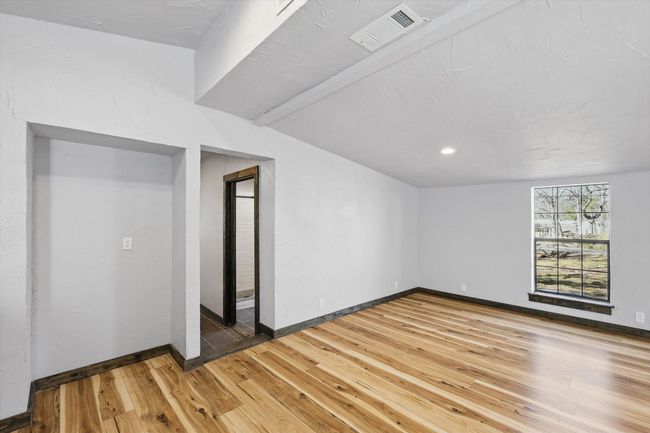 Empty room featuring visible vents, light wood-style flooring, and baseboards | Image 19