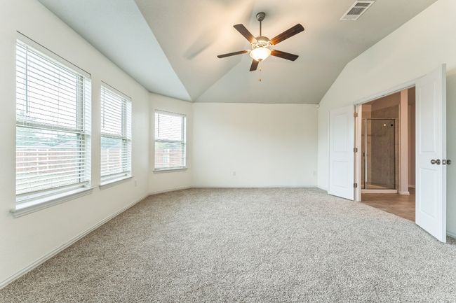 Unfurnished room with ceiling fan, carpet, and vaulted ceiling | Image 12