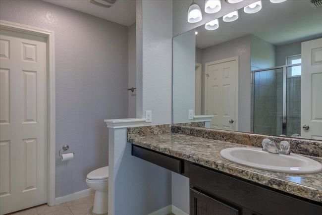 Primary bathroom. Plenty of counter space and a make-up vanity area. | Image 24
