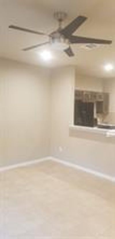 Unfurnished room with ceiling fan | Image 3