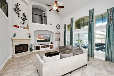 Another highlight as can be seen in the family room is the high ceilings and open floor plan. With all the large windows you will have plenty of natural light during the day. | Image 3