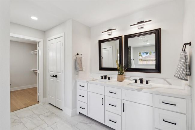 The dual vanities combine style and function, providing plenty of space for two. | Image 19