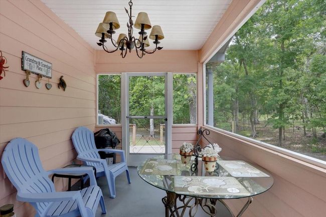 Enjoy the peace and quiet here on the side screened porch leading out to the back deck ...ohhh the views! | Image 16