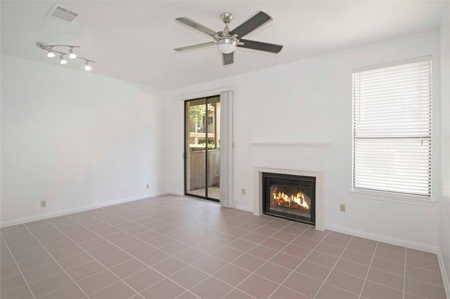 Original Image of the Living Room with WBFP and Sliding door to private courtyard. | Image 8