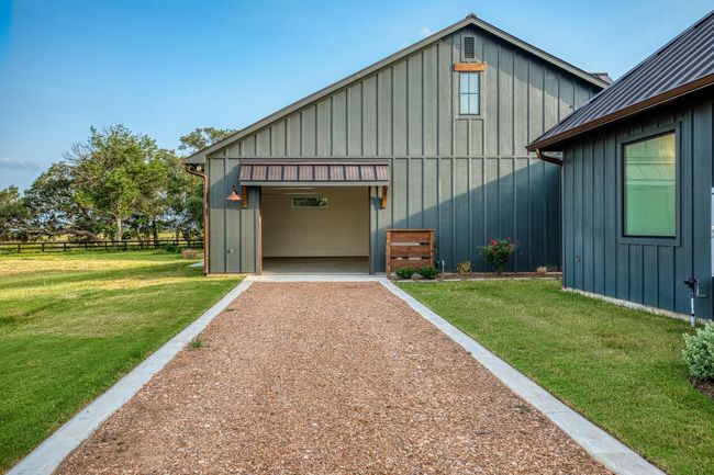 Additional garage space for extra storage or parking. | Image 32