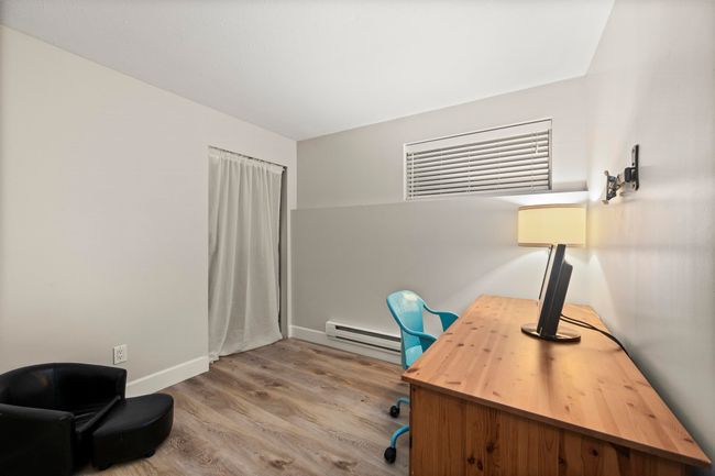 Office featuring a baseboard heating unit, baseboards, and wood finished floors | Image 31