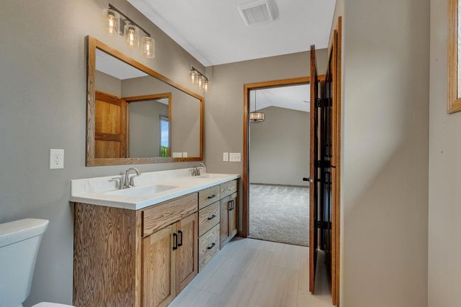 Dual sinks in the private primary bathroom | Image 12