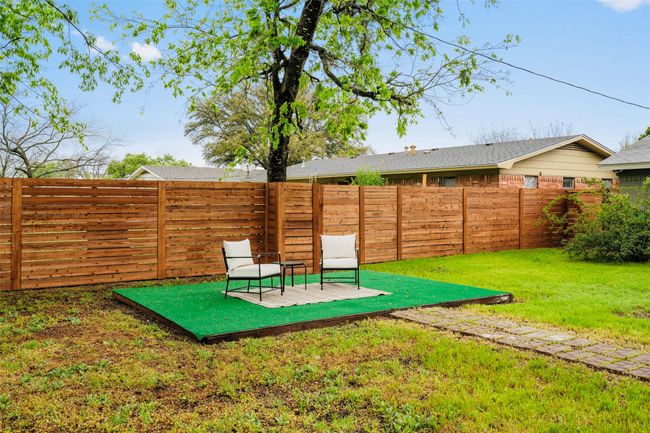 Fenced backyard featuring a patio | Image 39