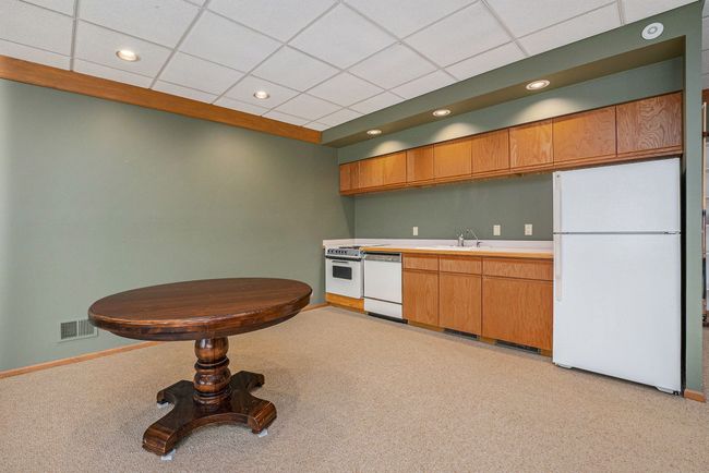 Lower kitchenette w/ fridge, dishwasher, range | Image 29