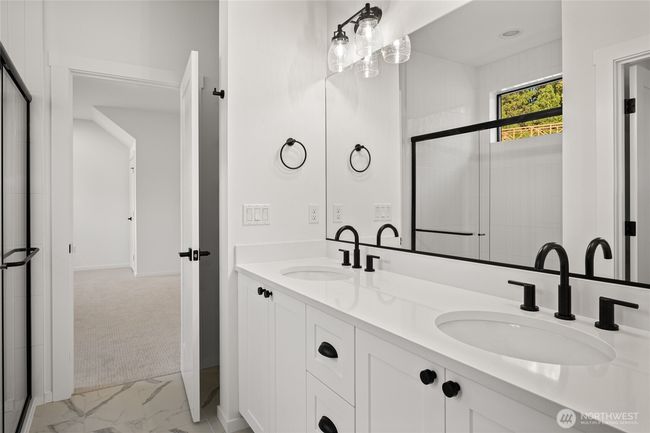 As the newest PNW master-planned community, enjoy 200+ acres of open space, trails & the Coal Trax Mt Bike Park. Soaring ceilings in the great roommake each day worthy of celebration & open floorplan appeals to entertaining. Covered deck & patio. Southern-facing homesites range from the mid600s- 900ks. Enjoy a variety of innovative & distinctive new home options with the best all-season recreation just moments away! Built for the future, indulge in a retreat just 90-min to Seattle. Plans and elevations are artist’s renderings only, may not accurately represent the actual condition of a home asconstructed and may also contain options and upgrades which are not included in the sale. Trailside Homes reserves the right to make changes to the floorplan, specifications, dimensions, design and elevations without prior notice. Stated dimensions and square footage are estimated and should not be usedas representations of the home’s actual size. | Image 24