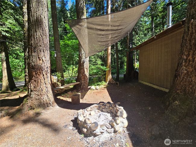 Enjoy nature around your custom river rock fire pit. | Image 26