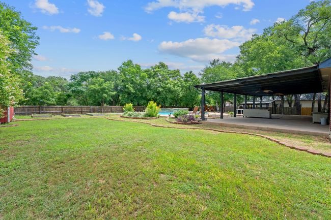 Fenced backyard featuring a patio area | Image 37