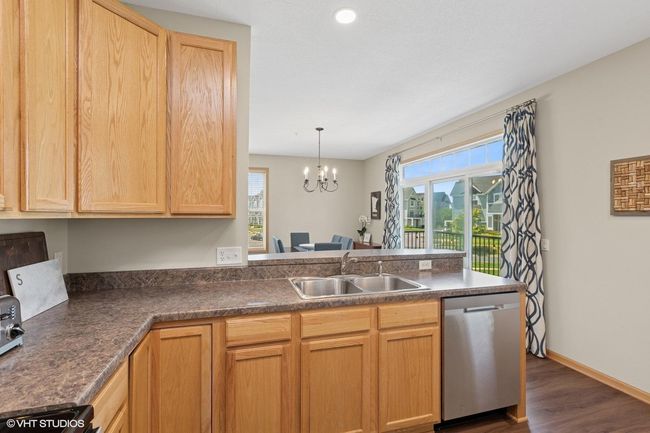 The open kitchen is filled with natural light, creating a bright and inviting atmosphere | Image 18