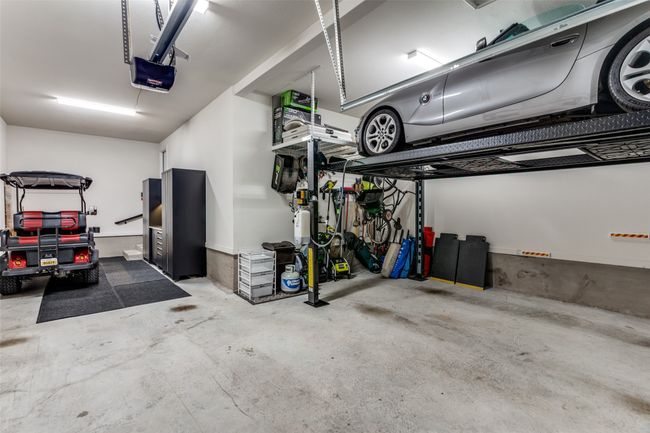 Garage with a garage door opener | Image 34