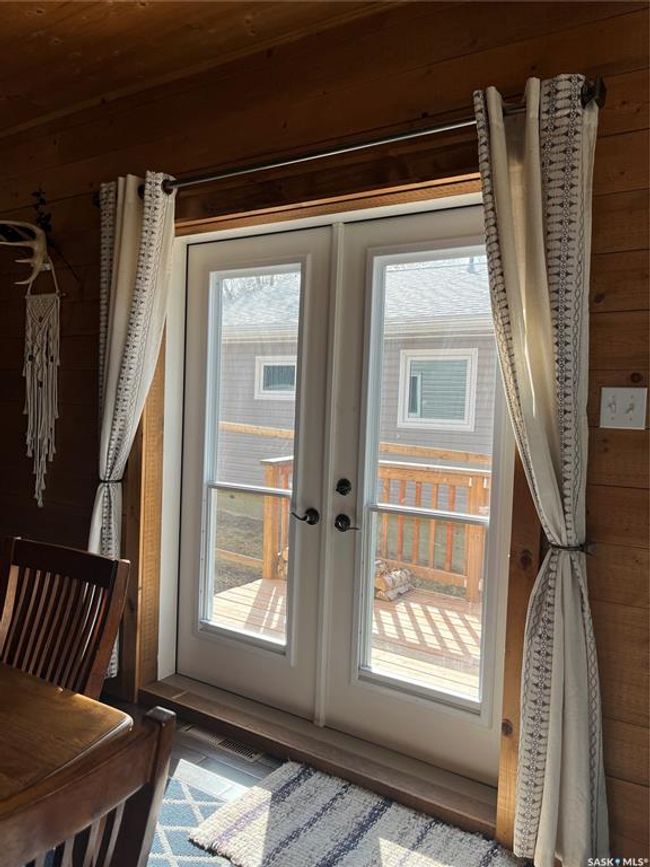 Entryway featuring wooden walls, french doors, and plenty of natural light | Image 16