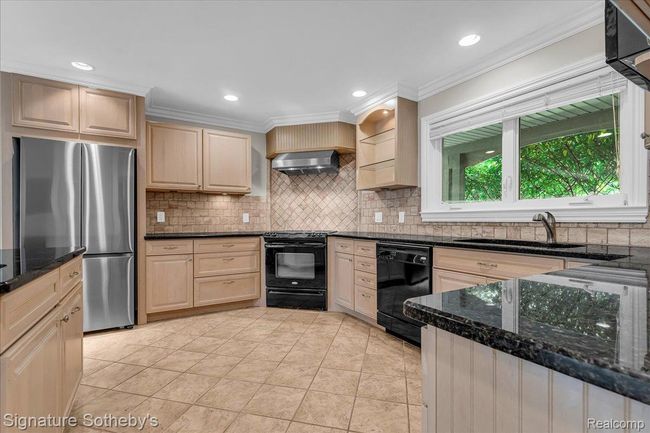 Kitchen with Indoor Grill, Peninsula Island, Granite Counters & Maple Cabinets | Image 14