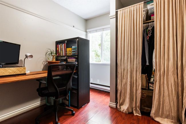 Office featuring baseboard heating and wood finished floors | Image 13