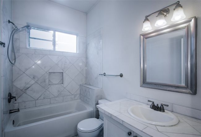 Bathroom featuring vanity and shower combination | Image 14