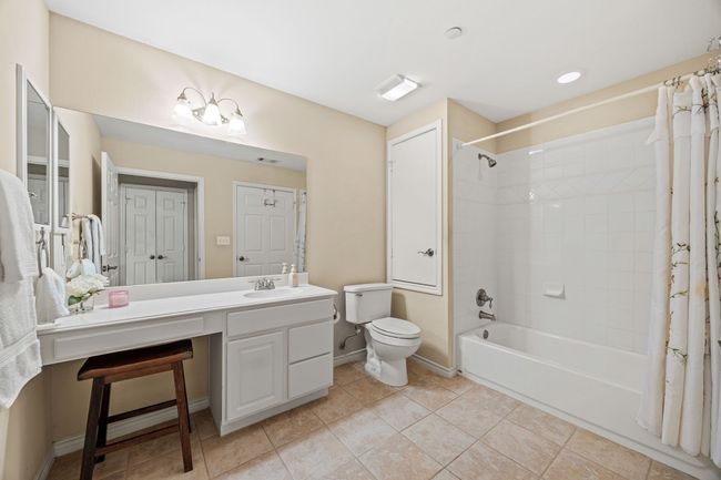Second bathroom with shower-tub combo. Storage closet. | Image 13