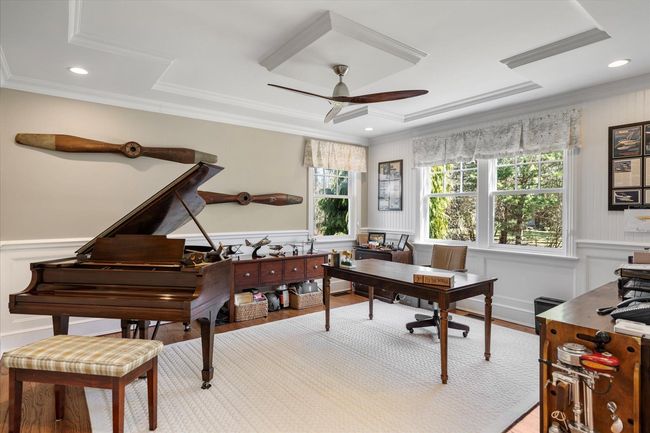 Home office featuring a wainscoted wall, wood finished floors, ornamental molding, and a ceiling fan | Image 5