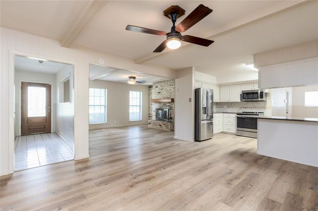Open floor plan with recent wood laminate flooring | Image 8