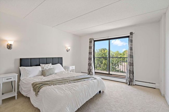 Bedroom with balcony access | Image 13