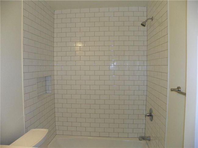 Bathroom with toilet and bathing tub / shower combination | Image 15