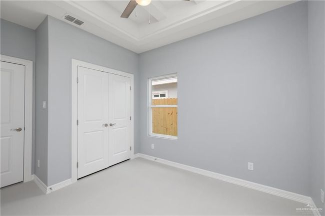 Unfurnished bedroom featuring a closet and ceiling fan | Image 11