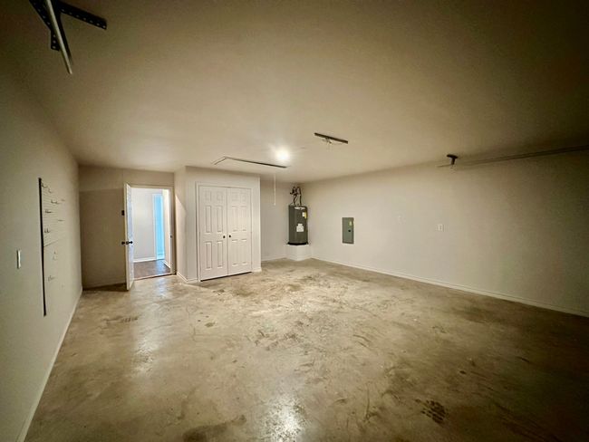 Below grade area with electric water heater and electric panel | Image 19