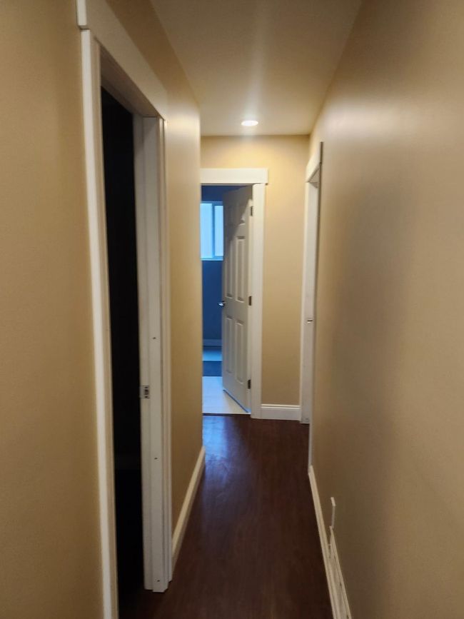 Corridor with dark wood-style floors and recessed lighting | Image 11