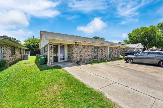 View of front of home with a front lawn, brick siding, and roof with shingles | Image 20