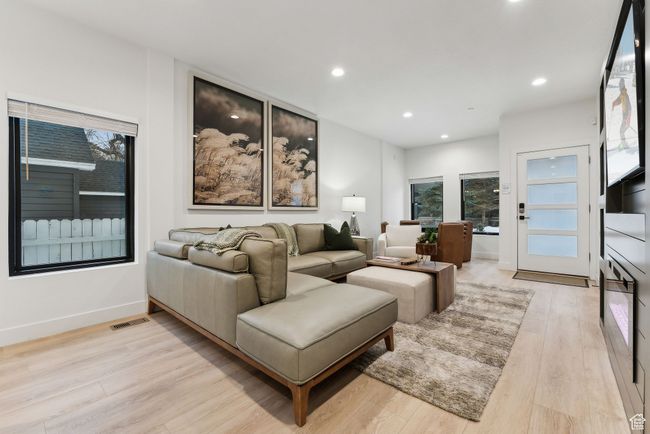 Living room featuring light hardwood / wood-style floors | Image 4