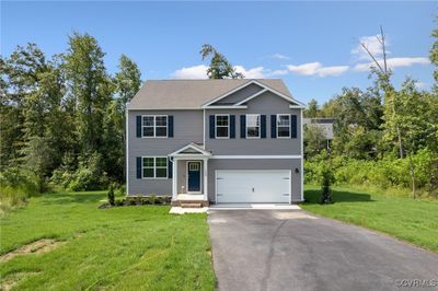 View of front of house with a front yard and a garage | Image 3