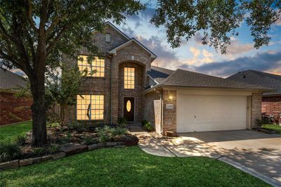 Welcome home to 22015 Gold Leaf Trail in the master-planned community of Fairfield. This home exudes warmth and comfort as day turns to dusk! | Image 1