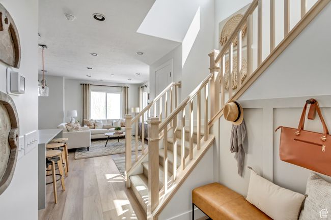 Stairs featuring wood finished floors and recessed lighting | Image 23
