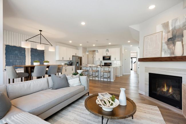 Come over to the living room perfect for any occasion! Both spacious and luxurious, this living room is perfect for any occasion! Photo of model home. | Image 4