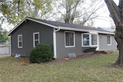 View of home's exterior with a lawn | Image 1