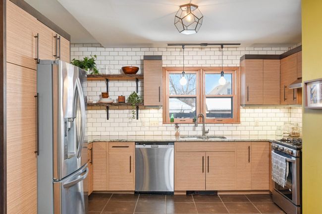 The kitchen, renovated in 2014, offers great workspaces & loads of cabinetry. | Image 12