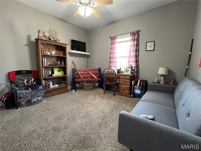 Office area with carpet floors and ceiling fan | Image 15