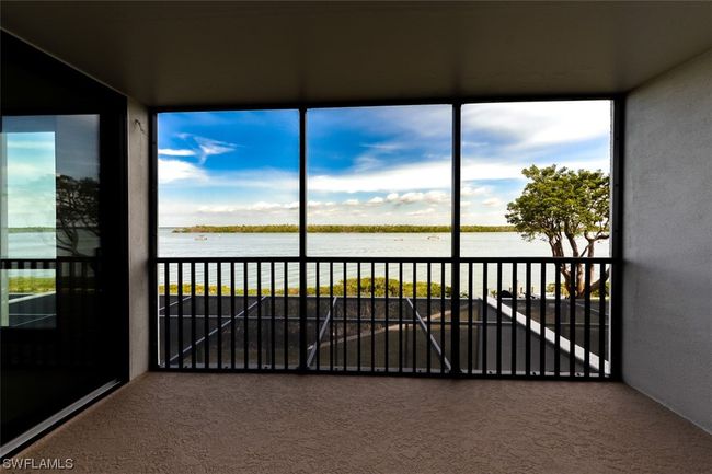 FULL ESTERO BAY VIEWS FROM NEWLY REDONE LANAI. ENTRANCE TO OWNER'S SUITE IS TO LEFT. | Image 20